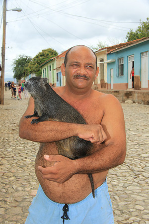 Man with Pet Jutia (Tree Rat)